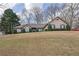 Charming single-story home with a manicured lawn and well-maintained landscaping, offering great curb appeal at 480 Firelite Ln, Suwanee, GA 30024