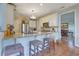 Charming kitchen features granite counters, stainless steel appliances and hardwood floors at 480 Firelite Ln, Suwanee, GA 30024