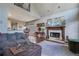 Open-concept living space featuring hardwood floors, a comfortable couch, and seamless kitchen access at 480 Firelite Ln, Suwanee, GA 30024