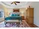 Relaxing main bedroom featuring wood floors, trey ceilings and large windows at 480 Firelite Ln, Suwanee, GA 30024