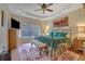 Spacious main bedroom with tray ceiling, decorative fan, and ample natural light at 480 Firelite Ln, Suwanee, GA 30024