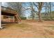 Large, undeveloped backyard with a wooden deck and plenty of space for landscaping at 5960 Magnolia Rdg, Stone Mountain, GA 30087