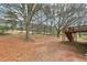 Spacious backyard featuring a deck and mature trees, perfect for outdoor enjoyment and relaxation at 5960 Magnolia Rdg, Stone Mountain, GA 30087