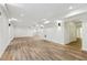 Finished basement with light wood floors, white walls, recessed lighting, bar area, and walk out at 5960 Magnolia Rdg, Stone Mountain, GA 30087