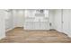 Basement with wet bar, cabinets, countertops, and plank flooring at 5960 Magnolia Rdg, Stone Mountain, GA 30087