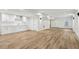 Finished basement with light wood floors, white walls, recessed lighting, bar area, and walk out at 5960 Magnolia Rdg, Stone Mountain, GA 30087