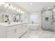 Spa-like bathroom features double vanity, soaking tub, and tiled shower at 5960 Magnolia Rdg, Stone Mountain, GA 30087