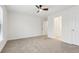 Bright bedroom featuring a carpeted floor and access to another room and a walk-in closet at 5960 Magnolia Rdg, Stone Mountain, GA 30087