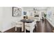 Chic dining area with modern lighting and comfortable seating adjacent to the well-equipped kitchen and living spaces at 5960 Magnolia Rdg, Stone Mountain, GA 30087