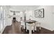 Cozy dining area situated near the kitchen, featuring stylish seating, hardwood floors and inviting natural light at 5960 Magnolia Rdg, Stone Mountain, GA 30087
