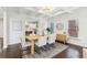 Beautiful dining room with coffered ceilings and views into the bright, white kitchen at 5960 Magnolia Rdg, Stone Mountain, GA 30087