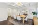 Charming dining room featuring coffered ceilings, hardwood floors and an open layout that connects to the kitchen at 5960 Magnolia Rdg, Stone Mountain, GA 30087