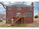 Brick house with a deck and stairs in the backyard at 5960 Magnolia Rdg, Stone Mountain, GA 30087