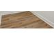 Close-up of light wood floors with white baseboards at 5960 Magnolia Rdg, Stone Mountain, GA 30087