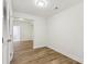 Hallway with light wood floors, white walls, closet, recessed lighting, and doorway at 5960 Magnolia Rdg, Stone Mountain, GA 30087