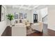 Bright living room features hardwood floors, large window, and coffered ceiling at 5960 Magnolia Rdg, Stone Mountain, GA 30087