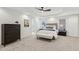 Spacious bedroom with a tray ceiling, ceiling fan, and ensuite bathroom at 5960 Magnolia Rdg, Stone Mountain, GA 30087