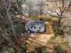 Aerial view of the house on a large lot with mature trees, landscaping and a paver patio at 1210 Beech St, Marietta, GA 30062