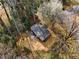 Aerial view of the house with mature trees, a large yard and a paver patio at 1210 Beech St, Marietta, GA 30062