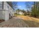 Paver patio and access to the basement of this house with a large backyard and mature trees at 1210 Beech St, Marietta, GA 30062