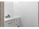 Bathroom vanity with white cabinets and marble countertops at 1210 Beech St, Marietta, GA 30062