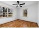 Bedroom featuring hardwood floors and two large windows at 1210 Beech St, Marietta, GA 30062