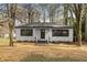 Cozy home with a well-manicured lawn and a welcoming entrance at 1210 Beech St, Marietta, GA 30062