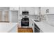 Bright kitchen with quartz countertops, stainless appliances, and white shaker cabinets at 1210 Beech St, Marietta, GA 30062