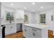 Bright kitchen with white cabinets, stainless steel appliances, and center island at 1210 Beech St, Marietta, GA 30062