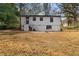 Back of house with yard, stairs leading to a rear entry and a paver patio at 1210 Beech St, Marietta, GA 30062