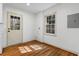 Bright room with wood floors, a window, and an exterior door at 1210 Beech St, Marietta, GA 30062