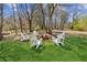 Inviting backyard featuring a fire pit surrounded by Adirondack chairs, perfect for outdoor gatherings at 5450 Frazer Rd, Buford, GA 30518