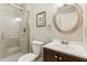 Modern bathroom features a glass-enclosed shower, a stylish vanity, and neutral-toned decor for a spa-like experience at 5450 Frazer Rd, Buford, GA 30518