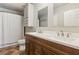 Bright bathroom featuring a double sink vanity with a mirror, modern fixtures, and a shower with a curtain at 5450 Frazer Rd, Buford, GA 30518