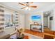 Open-concept living room with hardwood floors, a TV, and natural light from the window at 5450 Frazer Rd, Buford, GA 30518