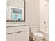 Bathroom with white subway tile, vanity with marble countertop, and modern fixtures at 66 Rogers Ne St, Atlanta, GA 30317
