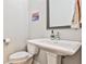 Clean bathroom with pedestal sink and toilet at 66 Rogers Ne St, Atlanta, GA 30317