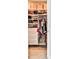 Organized walk-in closet features shelving with folded clothes, drawers, and hanging rods at 66 Rogers Ne St, Atlanta, GA 30317