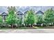 Charming townhomes with black trim and mature trees at 66 Rogers Ne St, Atlanta, GA 30317