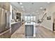 Modern kitchen boasts stainless steel appliances, an island with seating, and hardwood floors at 66 Rogers Ne St, Atlanta, GA 30317