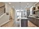Modern kitchen with a large island, sleek cabinets, stainless steel appliances, and an open floor plan at 66 Rogers Ne St, Atlanta, GA 30317