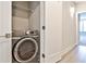 A modern laundry room with a new washer and dryer and ample storage space at 66 Rogers Ne St, Atlanta, GA 30317