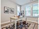 Bright office features hardwood floors, large windows, and a stylish desk at 66 Rogers Ne St, Atlanta, GA 30317