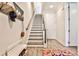 Staircase featuring wood treads, white risers, and stylish decor with a hat rack at 66 Rogers Ne St, Atlanta, GA 30317
