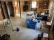 Spacious basement with wood paneling, concrete floors, and ample storage space at 217 Shields Rd, Stockbridge, GA 30281