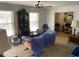 Bright living room with large windows and vintage furniture at 217 Shields Rd, Stockbridge, GA 30281