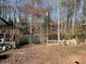 Scenic view of a tranquil pond surrounded by trees and a rustic wooden fence at 217 Shields Rd, Stockbridge, GA 30281