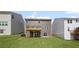 Backyard with a wooden deck, sliding glass doors, and a well-maintained lawn at 61 Okeechobee Way, Braselton, GA 30548