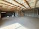 Unfinished basement with exposed beams, duct work, and concrete floors at 61 Okeechobee Way, Braselton, GA 30548