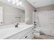 Bathroom featuring double sink, vanity, and shower-tub combination at 61 Okeechobee Way, Braselton, GA 30548